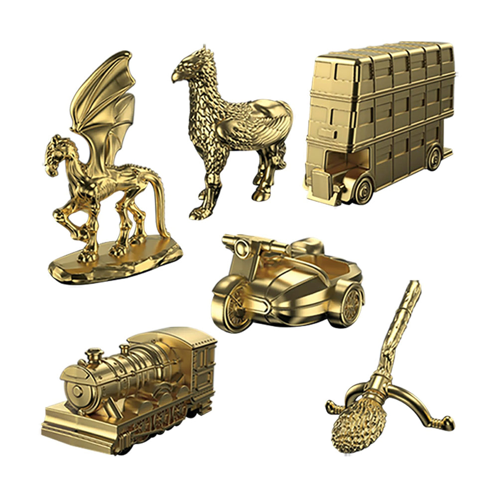 Figuras doradas de piezas de juego monopoly harry potter chile con formas de animales y transporte